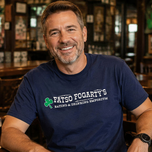 Man smiling at a neighborhood bar wearing Fatso Fogarty's North Arlington NJ retro t-shirt